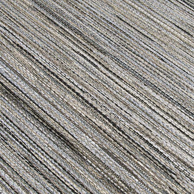 A close-up of the Couristan Cape Indoor/Outdoor Rug - Hinsdale/Light Brown-Silver displays its tightly woven texture and subtle color variation