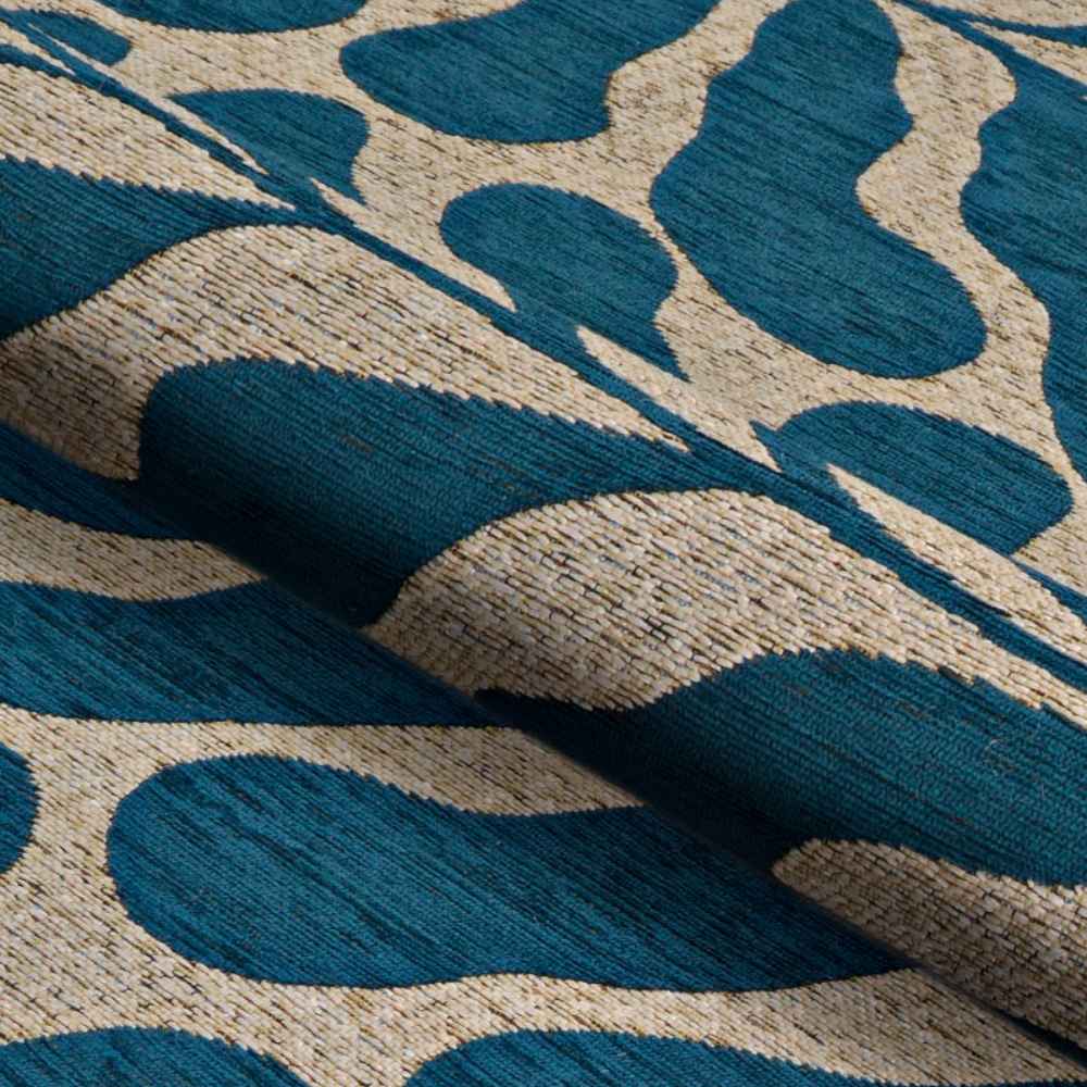 A close-up of the Couristan Castille Indoor/Outdoor Rug - Fiore/Petrol shows its soft texture and thick weave in teal and beige tones