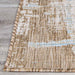 A close-up of the Couristan Charm Indoor/Outdoor Rug - Tiverton/Sand-Ivory corner reveals tightly bound edges and blended tones of sand, ivory, and sky blue