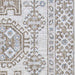 A close-up of the Couristan Charm Indoor/Outdoor Rug - Woodburn/Ivory-Sand highlights its woven texture and intricate geometric floral design