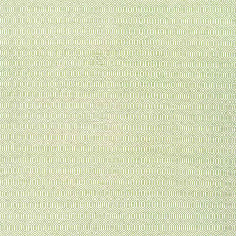 A close-up of the Couristan Cottages Indoor/Outdoor Rug - Southport/Green, featuring a repeating hexagon pattern in soft green and ivory tones