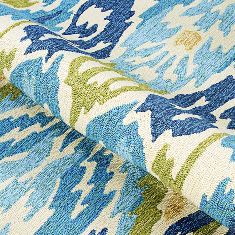 A close-up of the Couristan Covington Indoor/Outdoor Rug - Delfina/Azure-Lemon shows the rug’s durable loop pile construction and vibrant blue and green hues