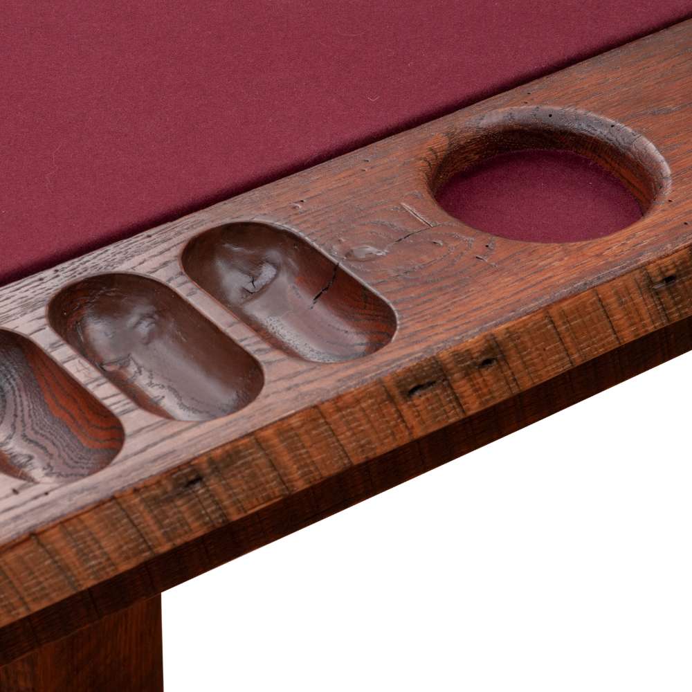 A close-up of the Fireside Lodge 6-Sided Poker Table shows its built-in wooden cup holders and carved slots for organizing poker chips