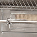 A close-up of the built-in rotisserie system with a sturdy rod and forks inside the Alfresco Grills 30″ Luxury Grill Built-In