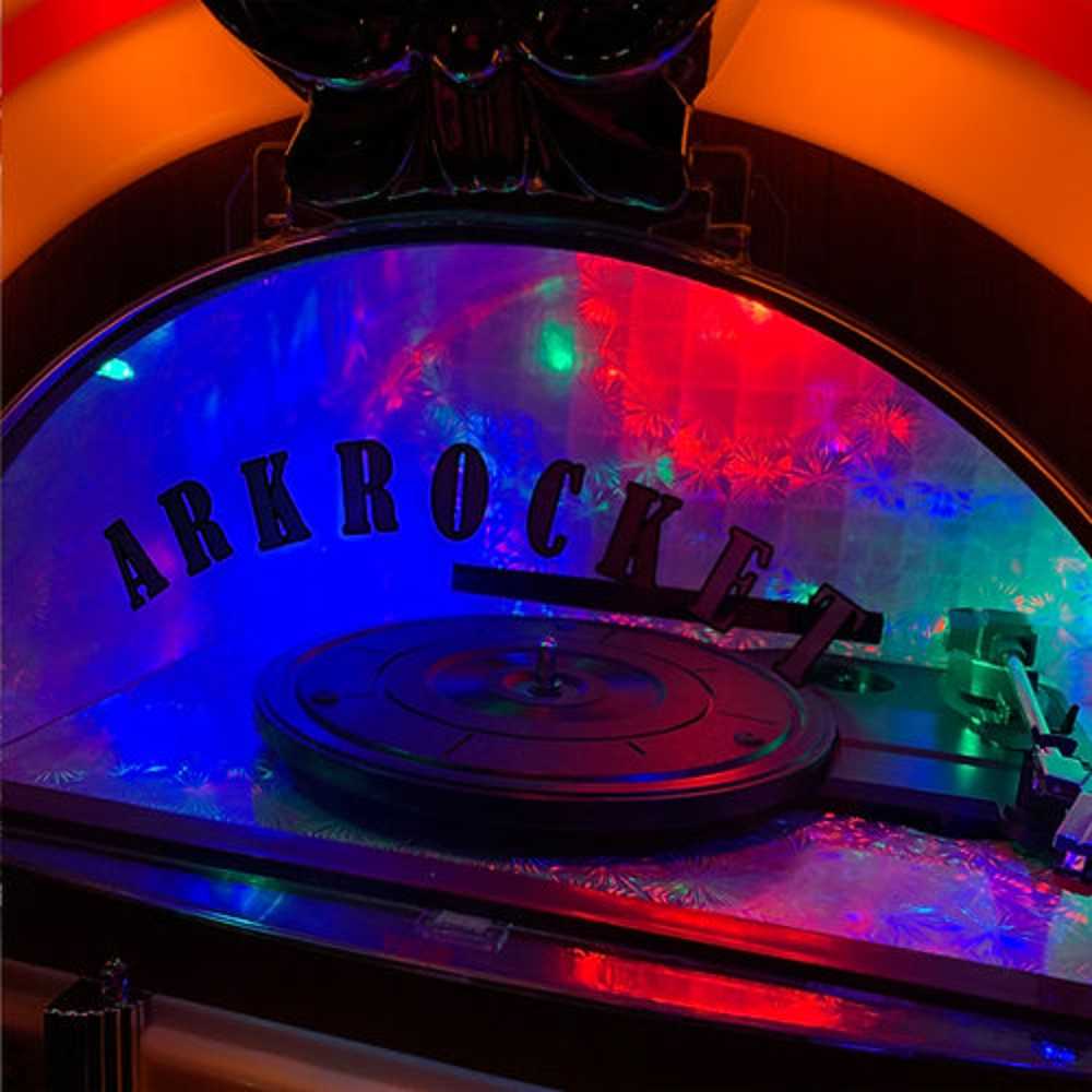 A close-up of the colorful, illuminated interior behind the turntable of Arkrocket Taurus Jukebox with Stand - Classic 2024 New Upgrade