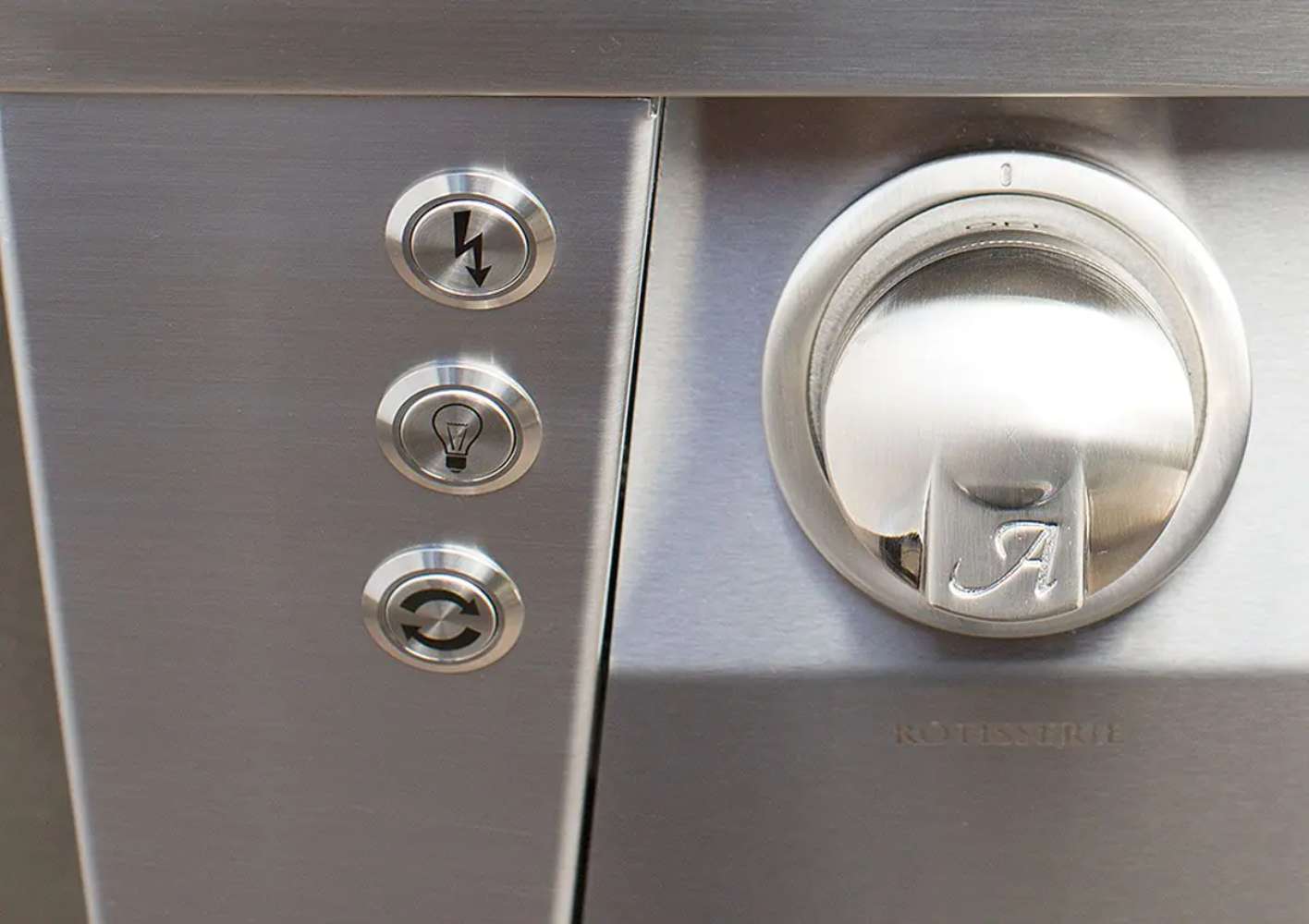 A close-up of the control panel on the Alfresco Grills 56″ Luxury All-Grill Built-In, featuring stainless steel knobs and buttons for ignition, lighting, and rotisserie functions