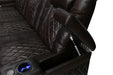 A close-up of the dark chocolate Valencia Tuscany XL Console Edition Home Theater Seating armrest reveals hidden storage and a sleek blue-lit cupholder