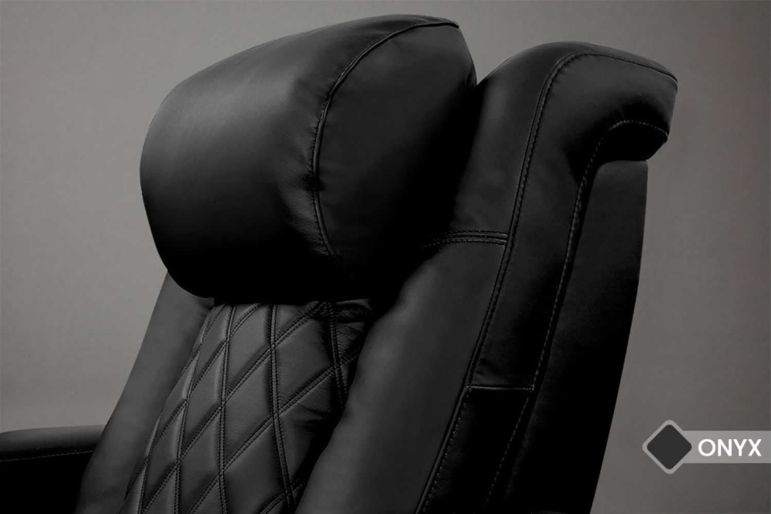 A close-up of the headrest from the Valencia Tuscany Luxury Edition Home Theater Seating highlights its plush cushioning and fine detailing