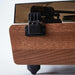 A close-up of the hinge at the back of Arkrocket Huygens Bluetooth Turntable with Built-in Speakers (Walnut)