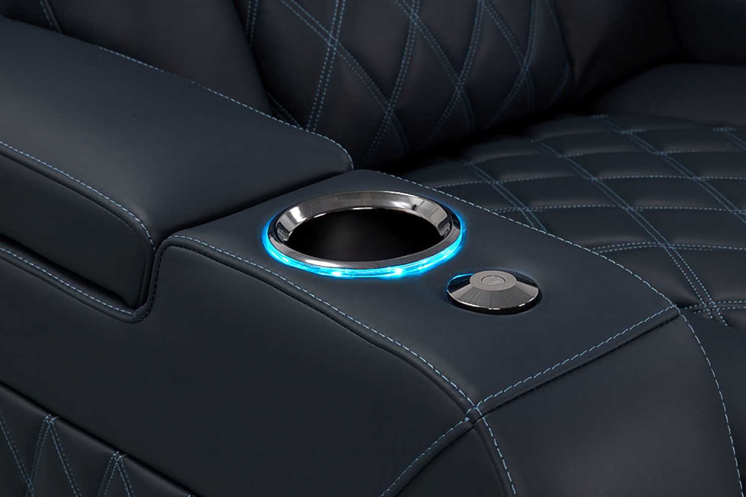 A close-up of the illuminated cup holder on the Valencia Tuscany Luxury Edition Home Theater Seating showcases sleek black chrome accents