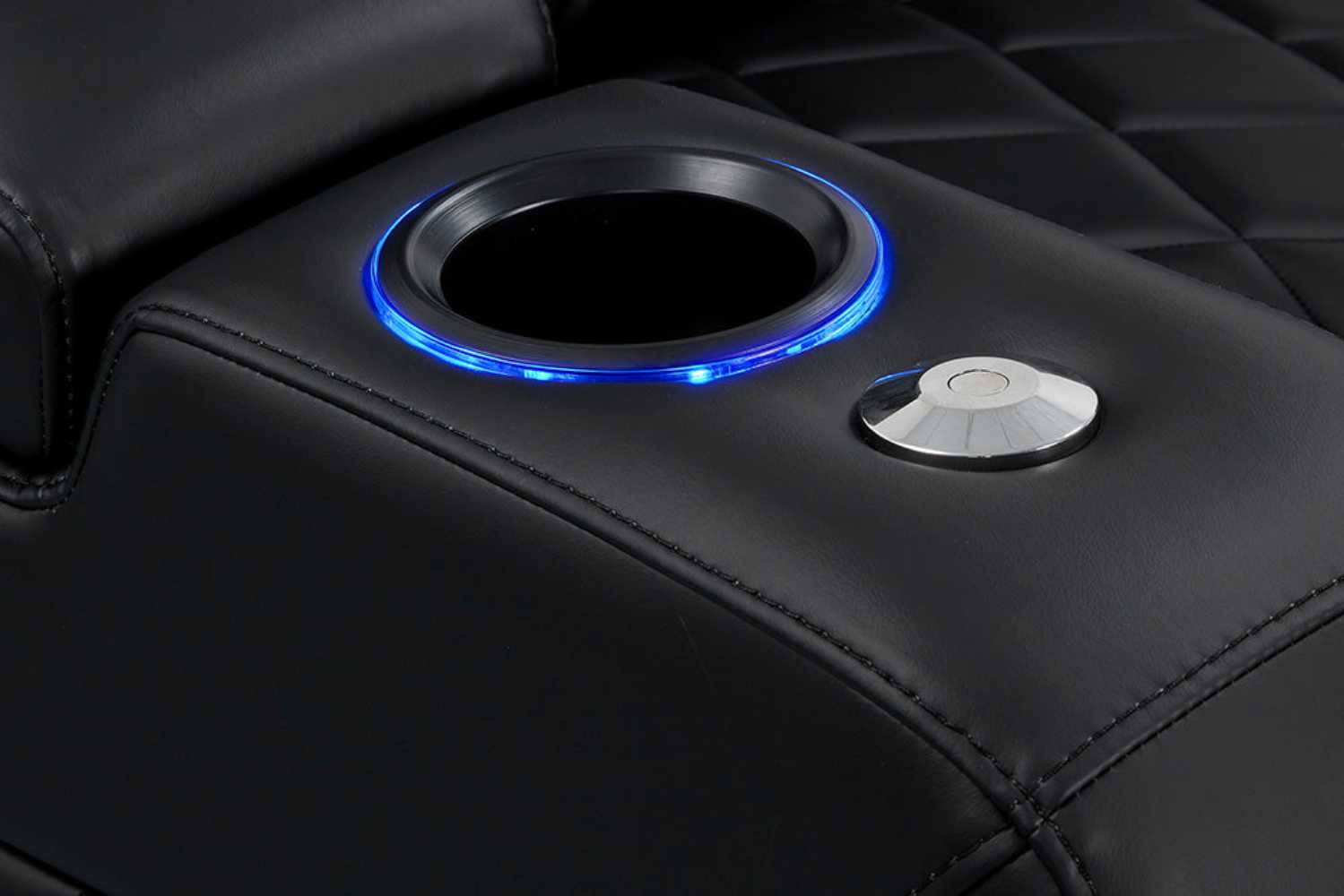 A close-up of the illuminated cup holder on the deep indigo Valencia Tuscany Vegan Edition Home Theater Seating