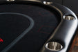 A close-up of the playing surface of the BBO Poker Tables Aces Pro Plus Poker Table reveals red outlined betting areas and integrated cup holders