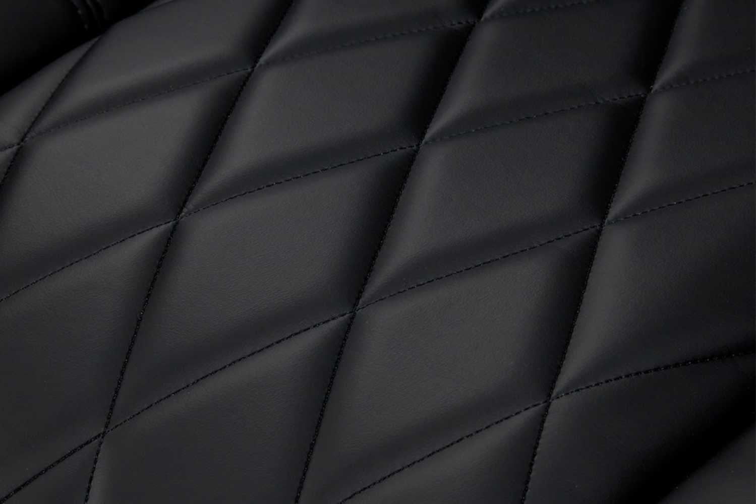 A close-up of the premium quilted vegan leather texture of the deep indigo Valencia Tuscany Vegan Edition Home Theater Seating