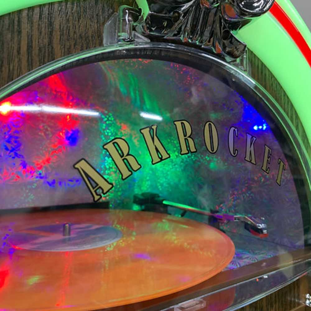 A close-up of the record player inside the Arkrocket Taurus II Jukebox - Dark Oak 2024 New Upgrade with bright, colorful lights reflecting off the vinyl