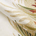 A close-up of the rug shows its looped texture and tropical colors, part of the Couristan Covington Indoor/Outdoor Rug - Tropics Garden/Sand-Multi