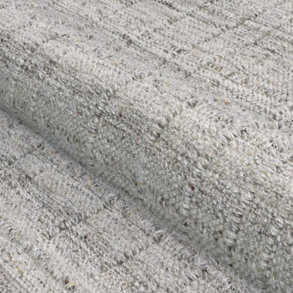 A close-up of the soft, textured weave shows the subtle checkered design of the Couristan Ascot Indoor/Outdoor Rug - Windowpane/Linen