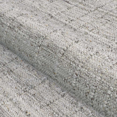 A close-up of the soft, textured weave shows the subtle checkered design of the Couristan Ascot Indoor/Outdoor Rug - Windowpane/Linen