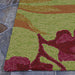 A close-up shows the looped texture of the Couristan Covington Indoor/Outdoor Rug - Painted Fern/Fern-Red