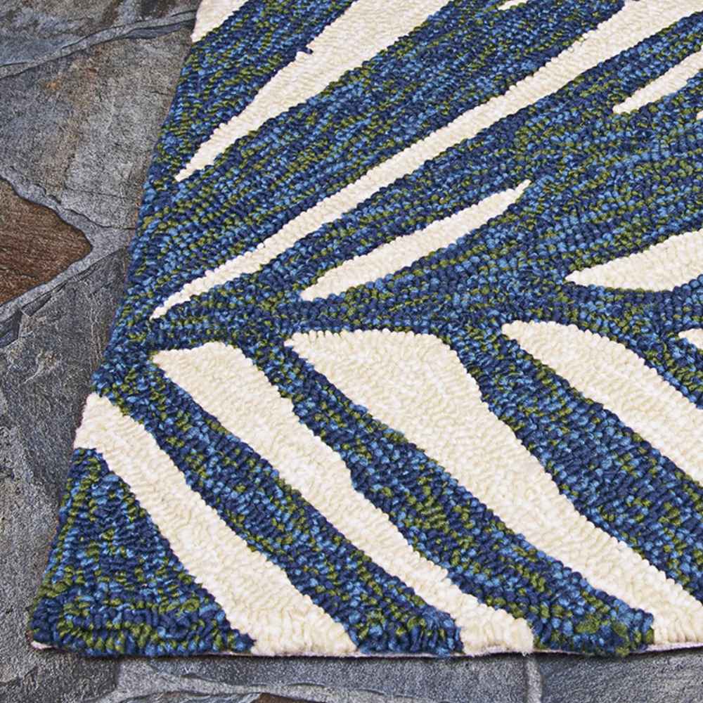 A close-up shows the thick, textured weave of the Couristan Covington Indoor/Outdoor Rug - Summer Laelia/Ivory-Fern with deep blue, green, and ivory stripes