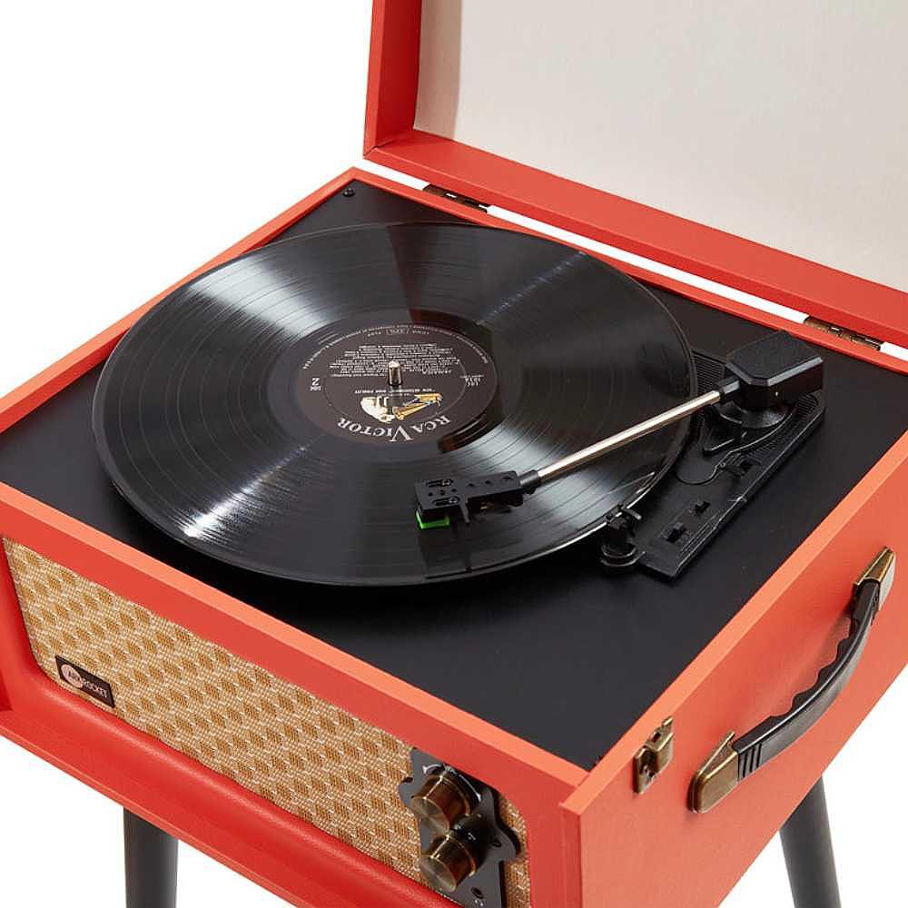 A close-up view of the Arkrocket Discovery II Bluetooth Turntable Record Player With Legs (Orange) shows an open lid with a black vinyl record