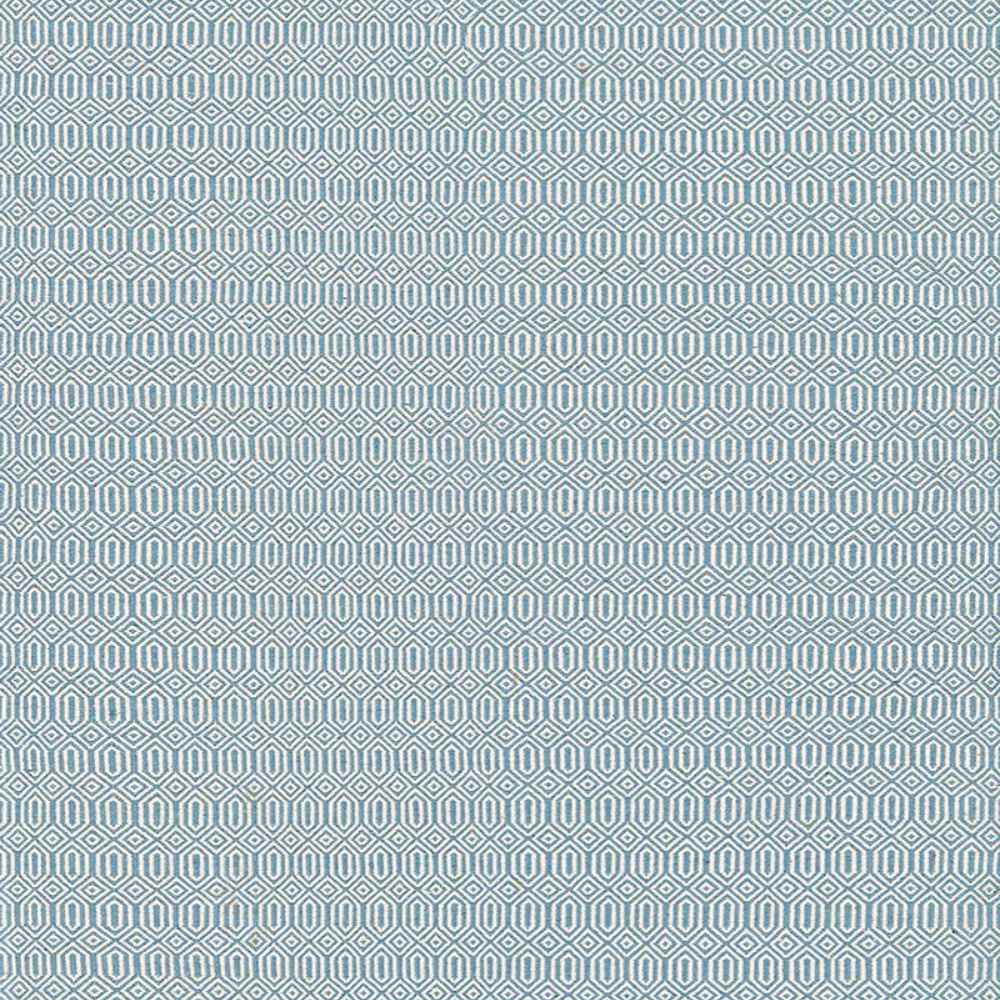 A close-up view of the Couristan Cottages Indoor/Outdoor Rug - Southport/Denim, featuring a repeating geometric pattern in denim blue and ivory