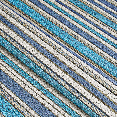 A close-up view reveals the textured, tightly woven fabric of the Couristan Cape Indoor/Outdoor Rug - Brockton/Cobalt-Teal with alternating stripes of blue, teal, and ivory