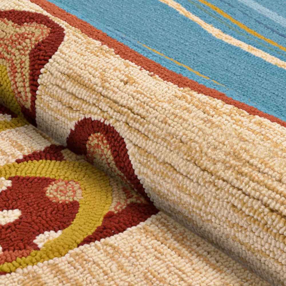 A close-up view shows the thick, textured loops of the Couristan Covington Indoor/Outdoor Rug - Sandals/Sand-Multi