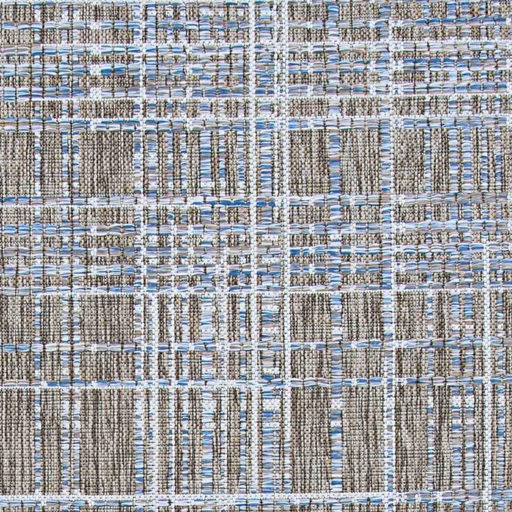 A close-up view shows the tightly woven texture of the Couristan Charm Indoor/Outdoor Rug - Ohe/Sand-Ivory with raised, striped threads in sand, ivory, and soft blue