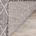 A close-up view shows the underside and weave texture of the Couristan Charm Indoor/Outdoor Rug - Thicket/Twig, highlighting its durable and tightly woven backing