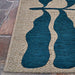 A corner close-up of the Couristan Castille Indoor/Outdoor Rug - Fiore/Petrol highlights its clean border and the clarity of its flowing leaf motif
