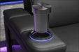 A cup holder accessory seamlessly integrated of the Valencia Monza Pillow Top Carbon Fiber Home Theater Seating