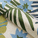A curled edge reveals the dense hooked surface of the Couristan Covington Indoor/Outdoor Rug - Summer Laelia/Ivory-Fern with bright tropical florals