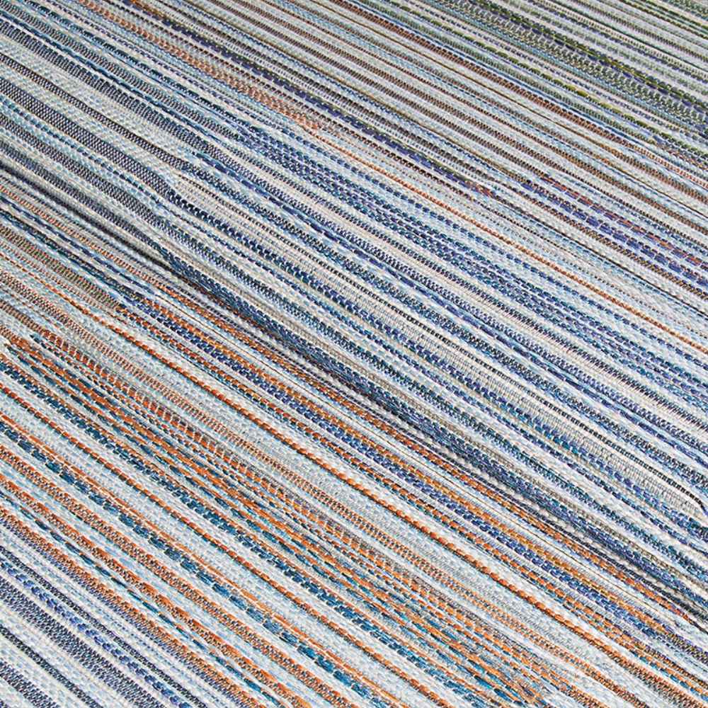 A detailed angled shot of the Couristan Cape Indoor/Outdoor Rug - Shoreham/Ivory-Multi emphasizes the vibrant weave and sturdy craftsmanship