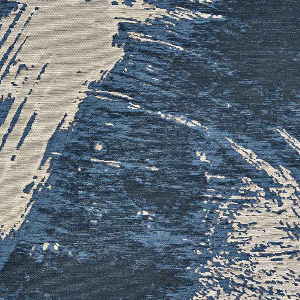 A detailed top-down shot of the Couristan Castille Indoor/Outdoor Rug - Canvas/Orion highlights its abstract blue and cream pattern