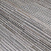 A detailed view of the Couristan Cape Indoor/Outdoor Rug - Fayston/Silver-Charcoal highlights its tightly woven, striped texture in neutral tones