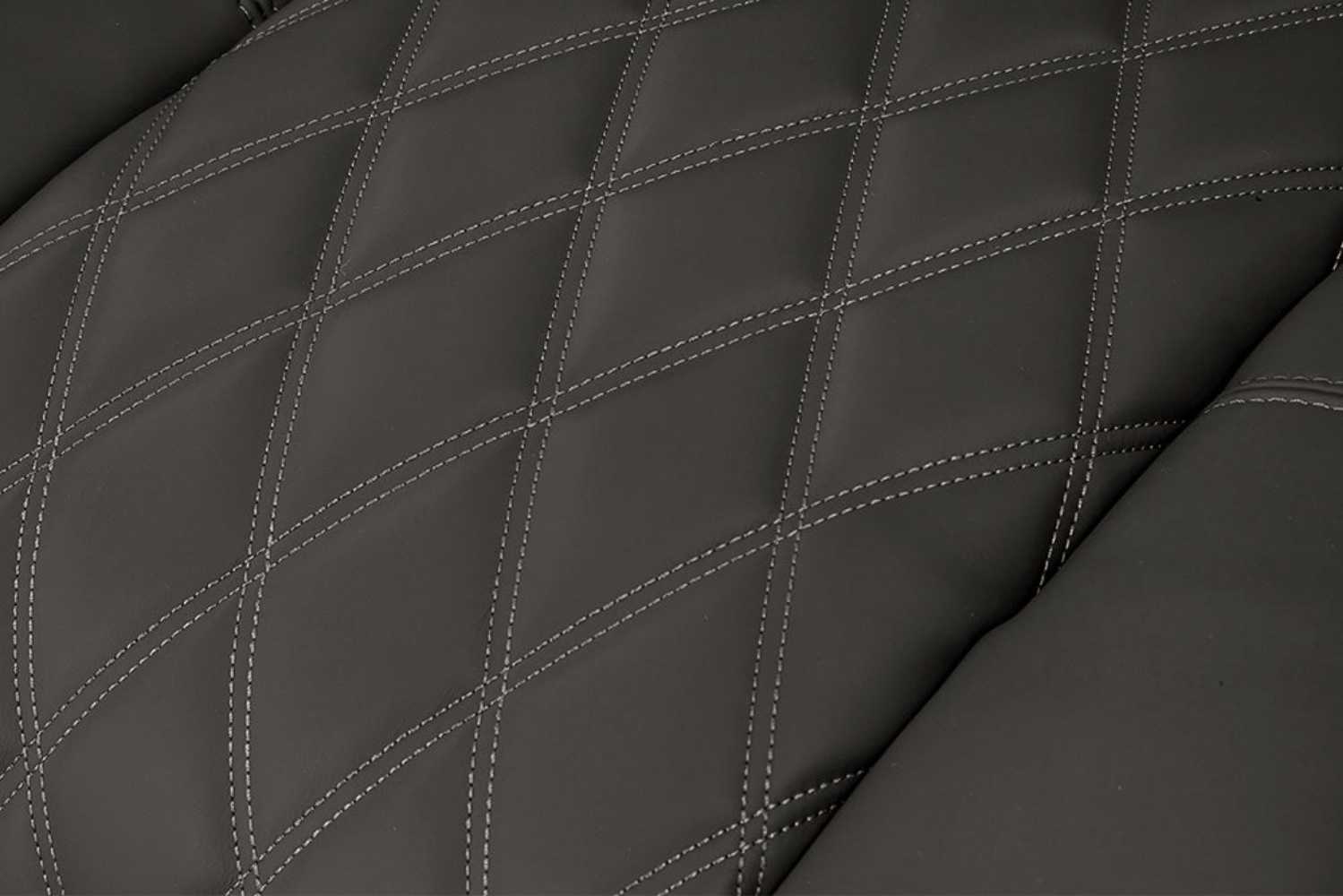 A detailed view of the diamond-stitched graphite leather on the Valencia Tuscany Luxury Edition Home Theater Seating