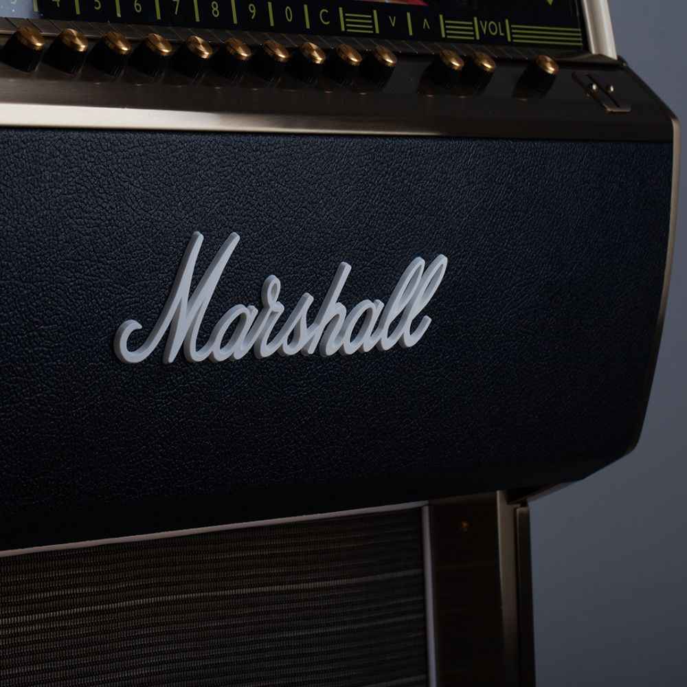 A detailed view of the gold and black control knobs on the Marshall Rocket Full Size LP Jukebox - Black, set against a textured black surface