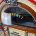 A detailed view of the top part of Arkrocket Taurus Jukebox with Stand - Classic 2024 New Upgrade showing the Arkrocket text and the turntable inside the clear dome