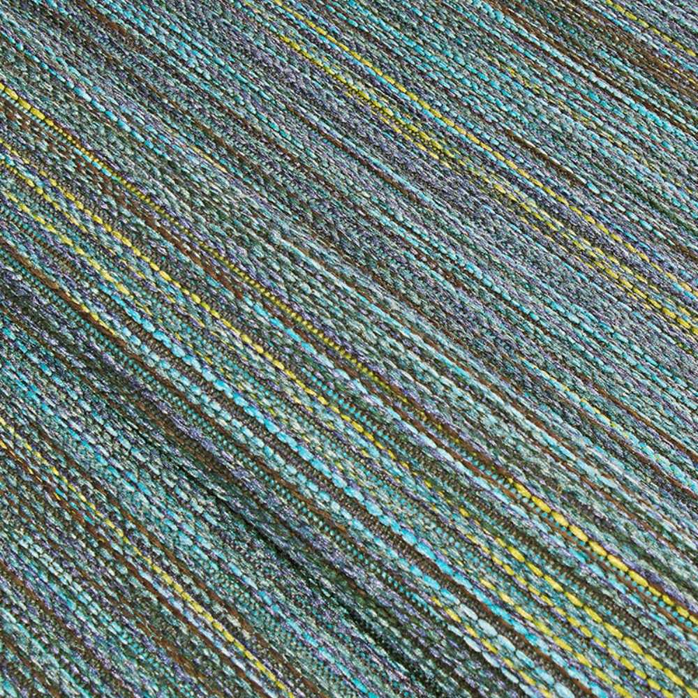A detailed zoom-in of the Couristan Cape Indoor/Outdoor Rug - Hinsdale/Teal-Cobalt displays its multicolored threads in teal, cobalt, and jade green