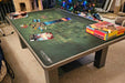 A festive board game night setup on the Game Theory Tables The Origins Coffee Table