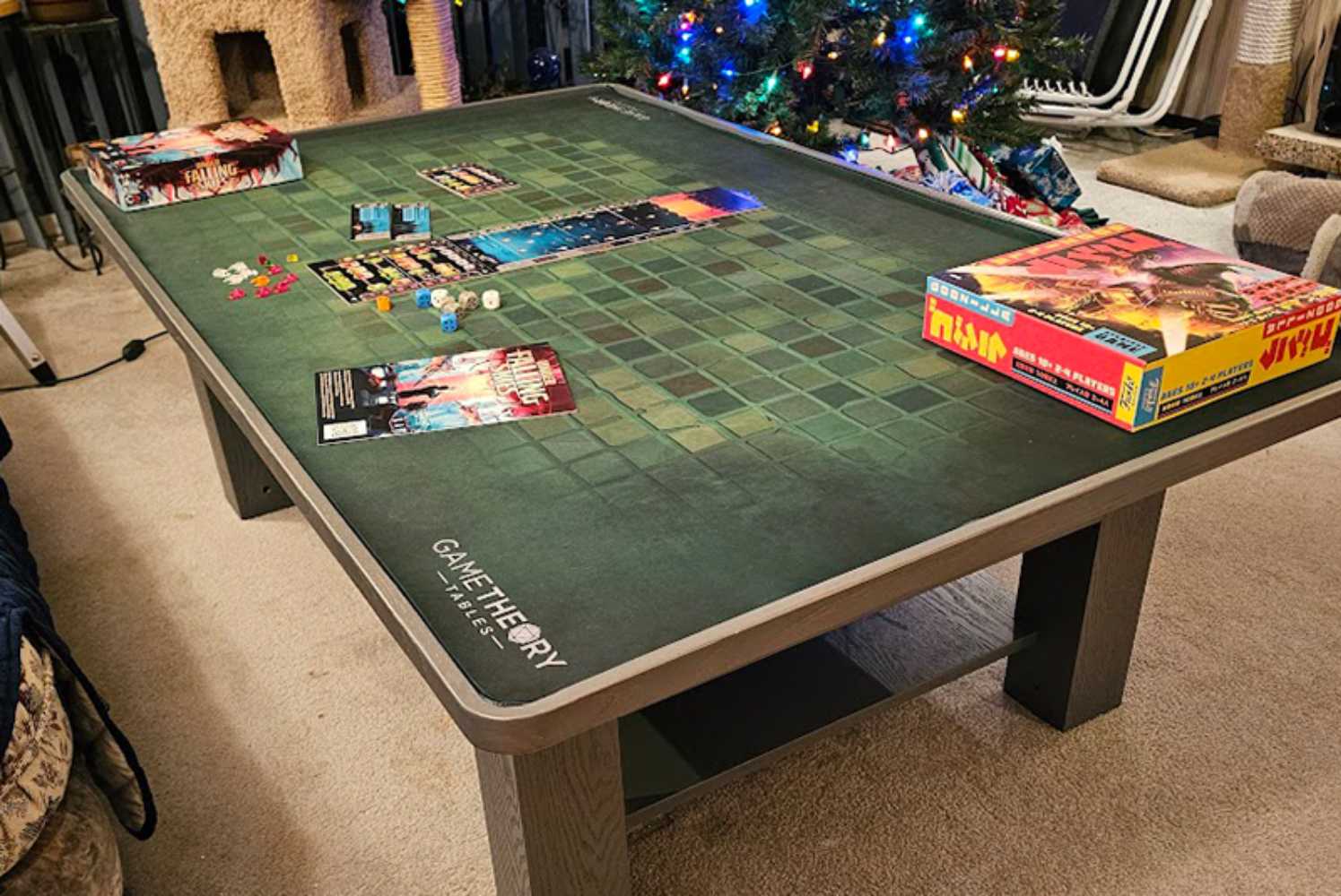 A festive board game night setup on the Game Theory Tables The Origins Coffee Table