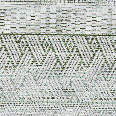 A flat section of the Couristan Cape Indoor/Outdoor Rug - Gables/Palm reveals repeating chevron and diamond motifs in green and ivory