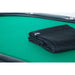 A folded BBO Poker Tables Heavy Duty Poker Table Travel Bag rests on a green playing surface