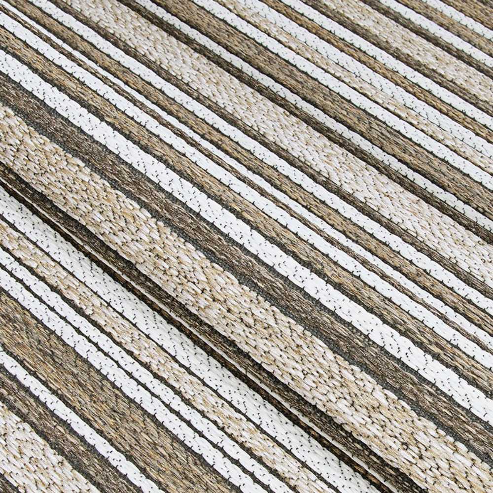 A folded section of the Couristan Cape Indoor/Outdoor Rug - Brockton/Light Brown-Ivory