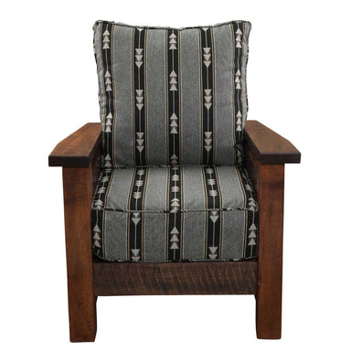 A front-facing view of the Fireside Lodge Barnwood Lounge Chair reveals a deep, cushioned seat and backrest with a gray arrow-patterned fabric