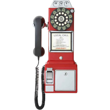 A front view of the Crosley 1950's Classic Pay Phone - Red, highlighting its rotary dial, black corded handset, and coin-operated slot