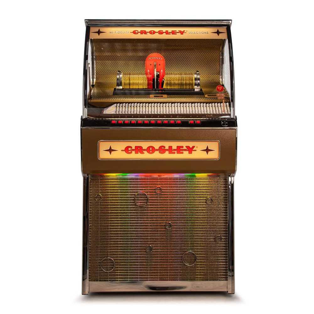 A front view of the Crosley Rocket 80 CD Bluetooth Full-Size Jukebox - Oak highlights its illuminated panel and classic jukebox styling