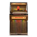 A front view of the Crosley Rocket 80 CD Bluetooth Full-Size Jukebox - Oak highlights its illuminated panel and classic jukebox styling