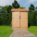 A front view of the Outdoor Living Today Maximizer 6×6 Wooden Shed displays its closed double doors with black metal hinges and handles