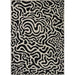 A full top-down view of the Couristan Castille Indoor/Outdoor Rug - Graffiti/Black-White displays its complete abstract pattern in black on a white surface